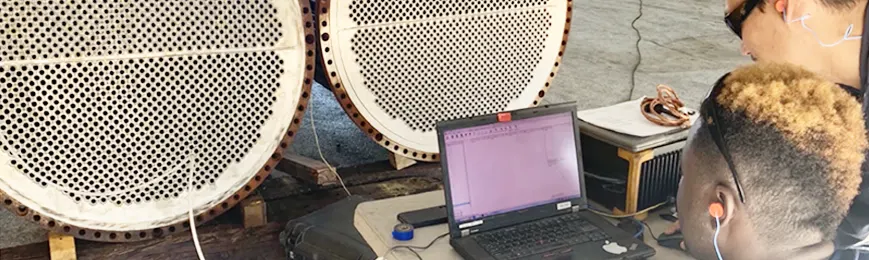 An image showing the Clean As New team analyzing heat exchangers
